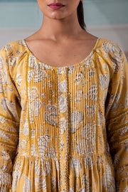 Glimmering yellow pintuck flared maxi dress