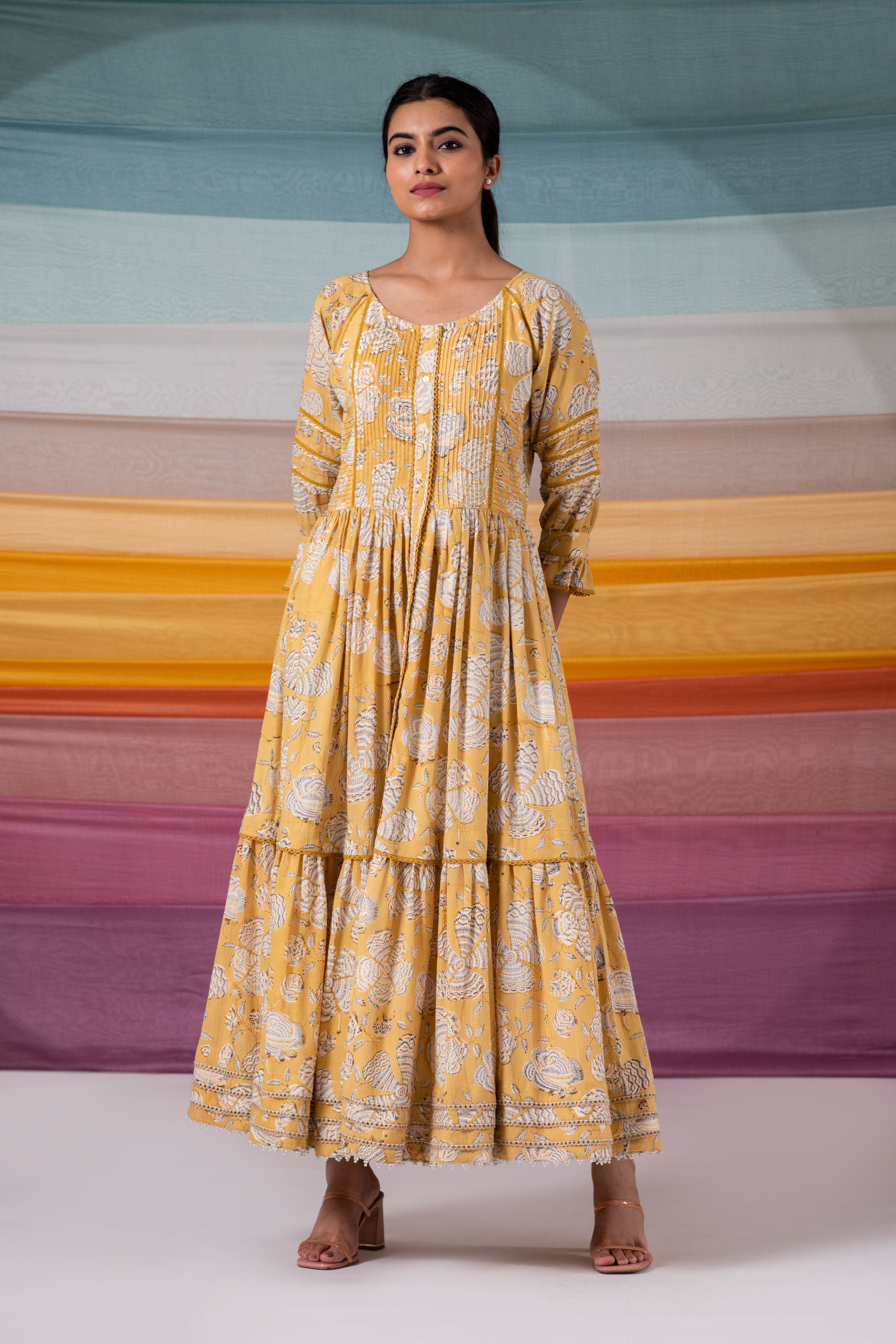 Glimmering yellow pintuck flared maxi dress